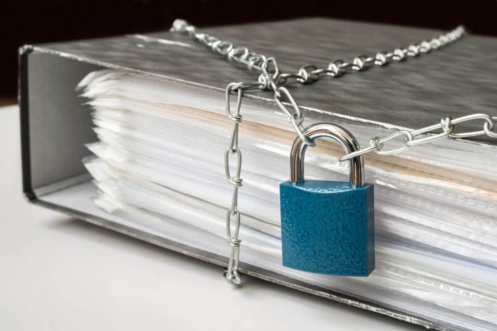 Files locked with chain and padlock - data and privacy security concept